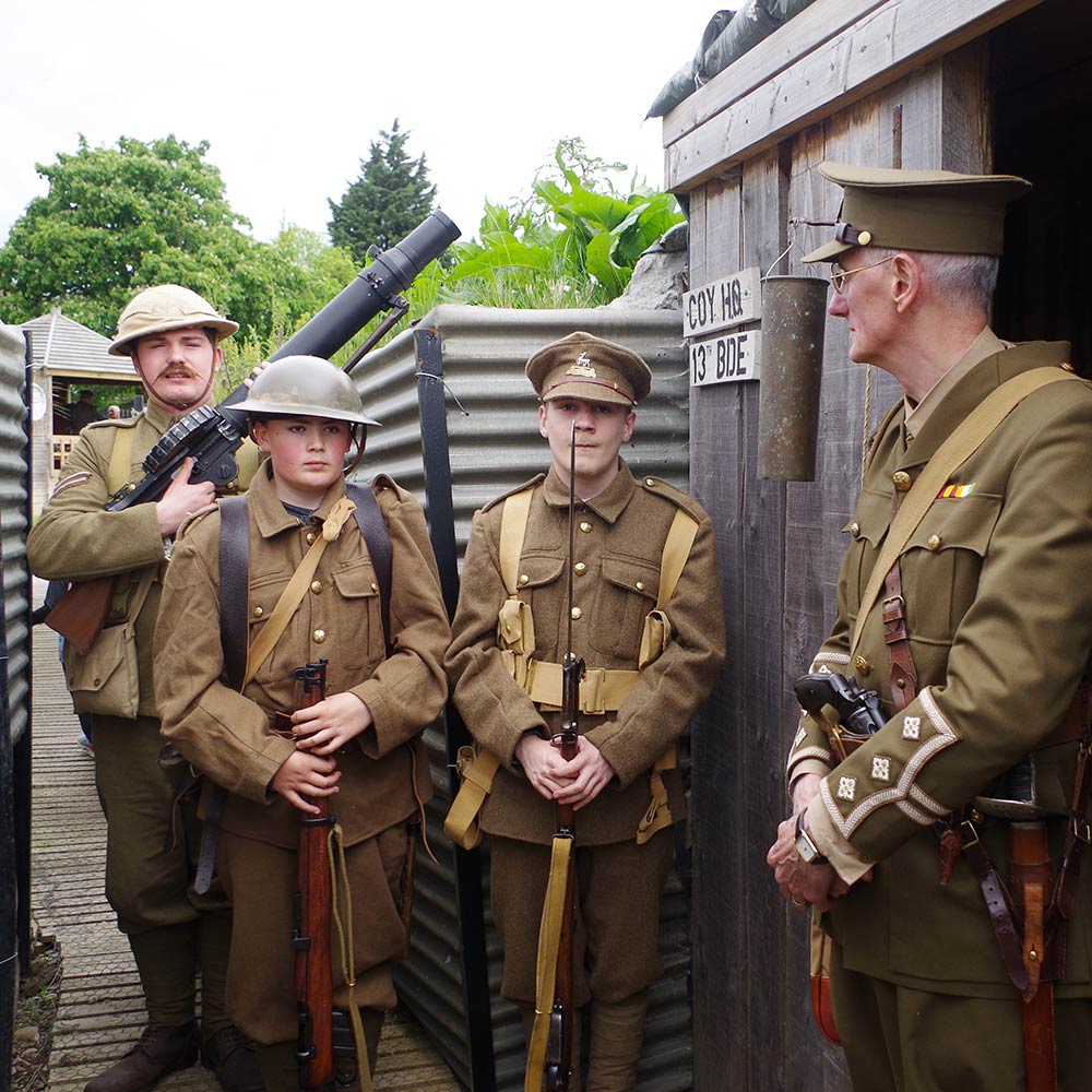 Troups with weapons standing in trench